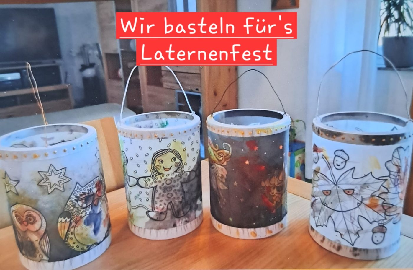 Vier selbst gebastelte, bunt bemalte Laternen stehen auf einem Tisch.